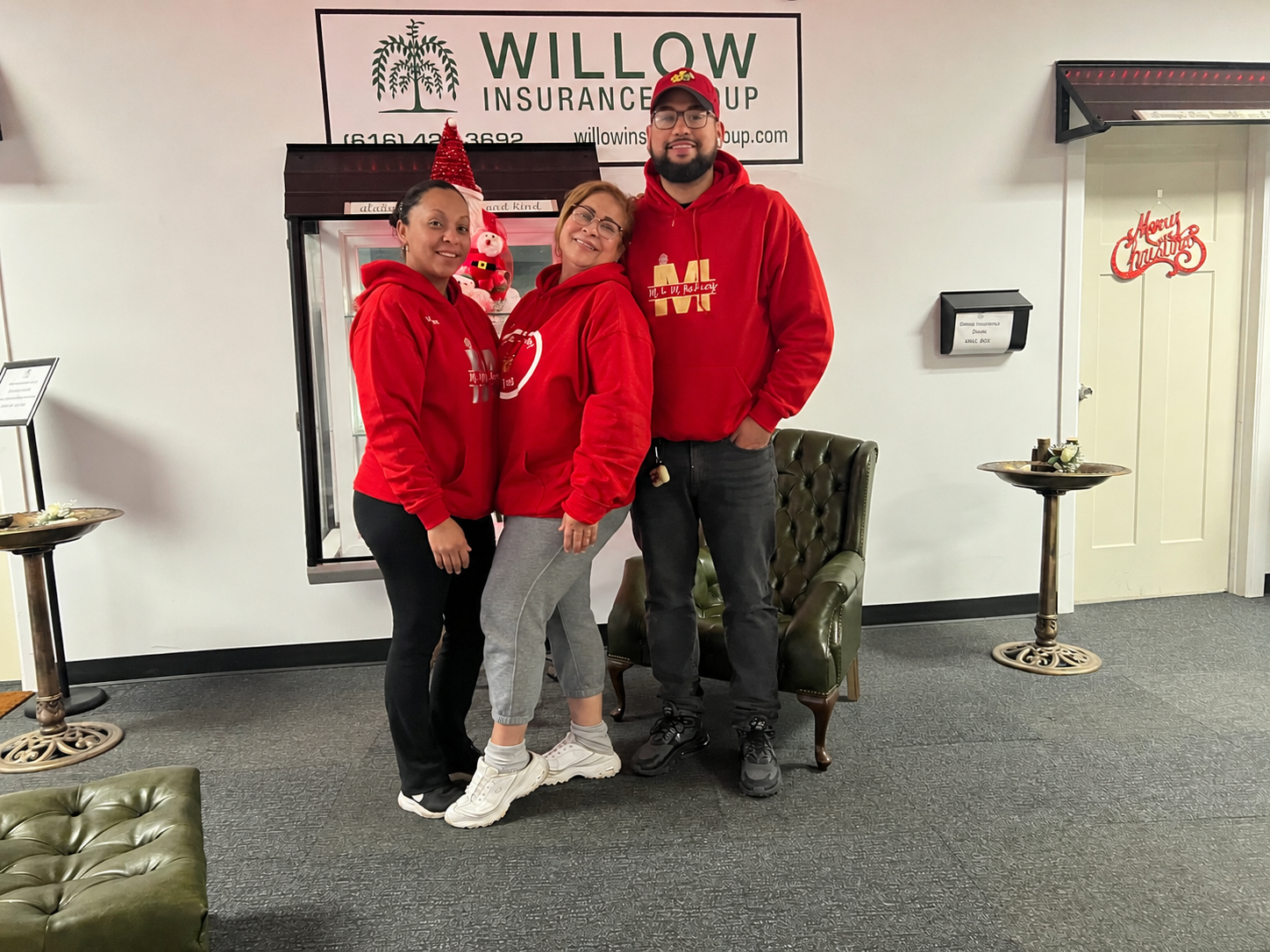 The M&M Bakery family team in matching red M&M Bakery hoodies